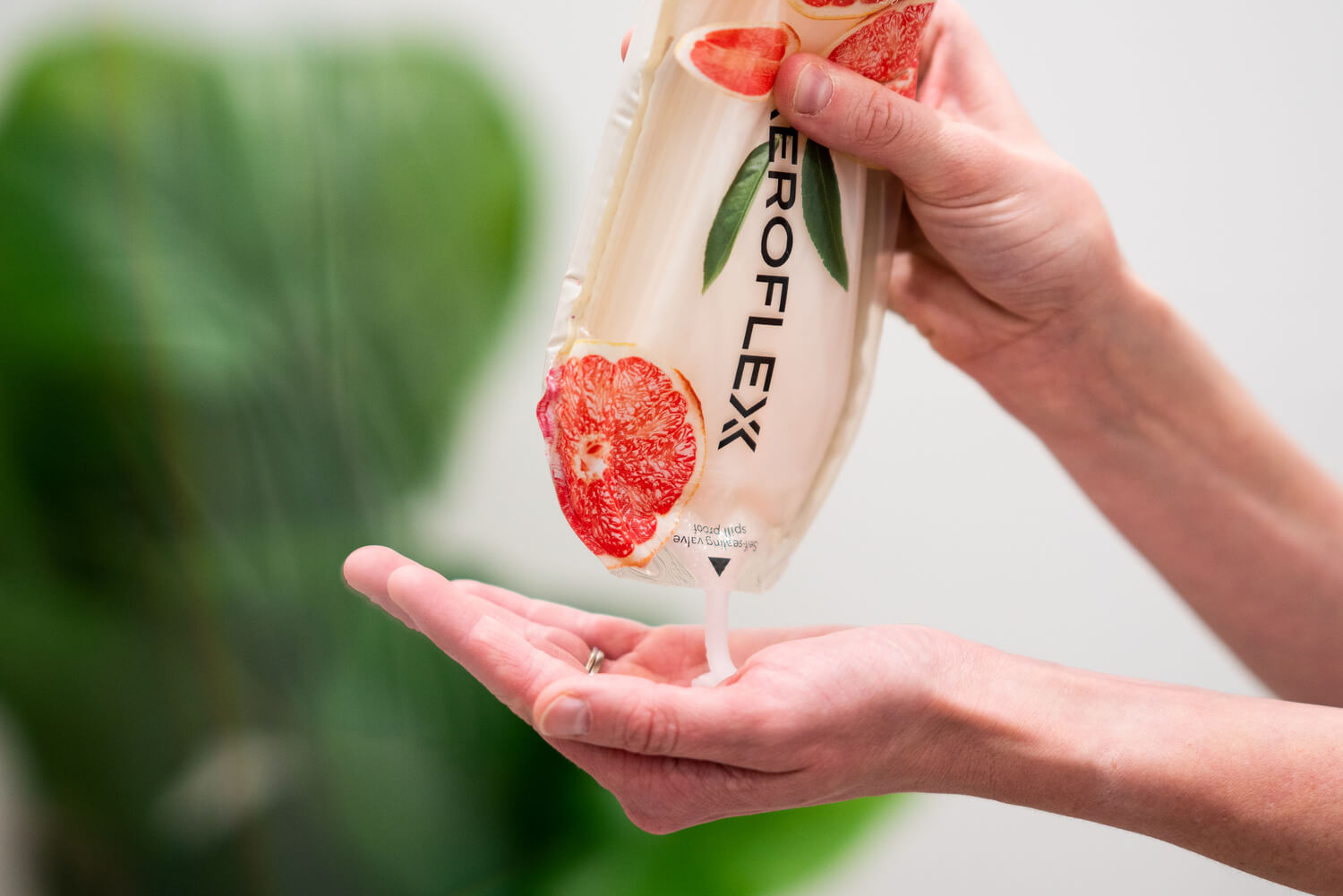 person squeezing out product of an AeroFlexx Pak
