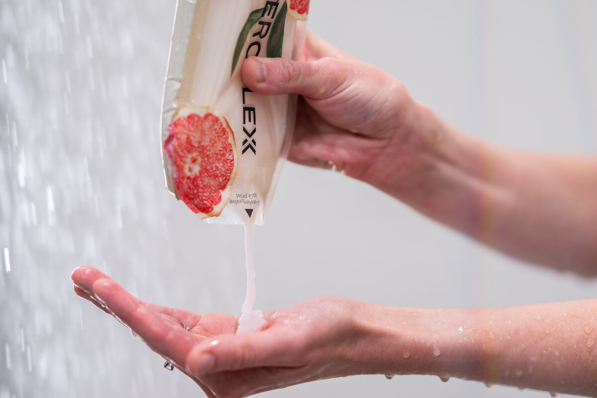 Person using Aerflexx Pak in the shower